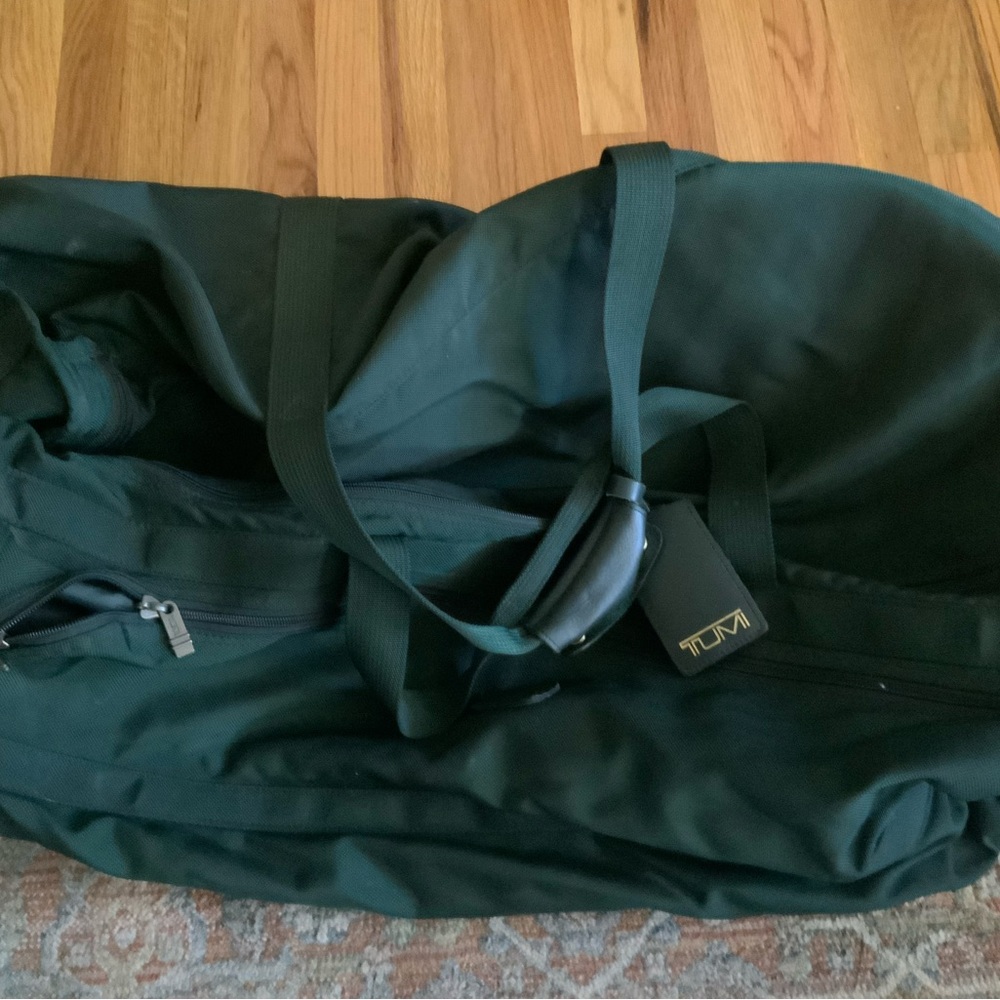 Large Tumi rolling duffel bag.